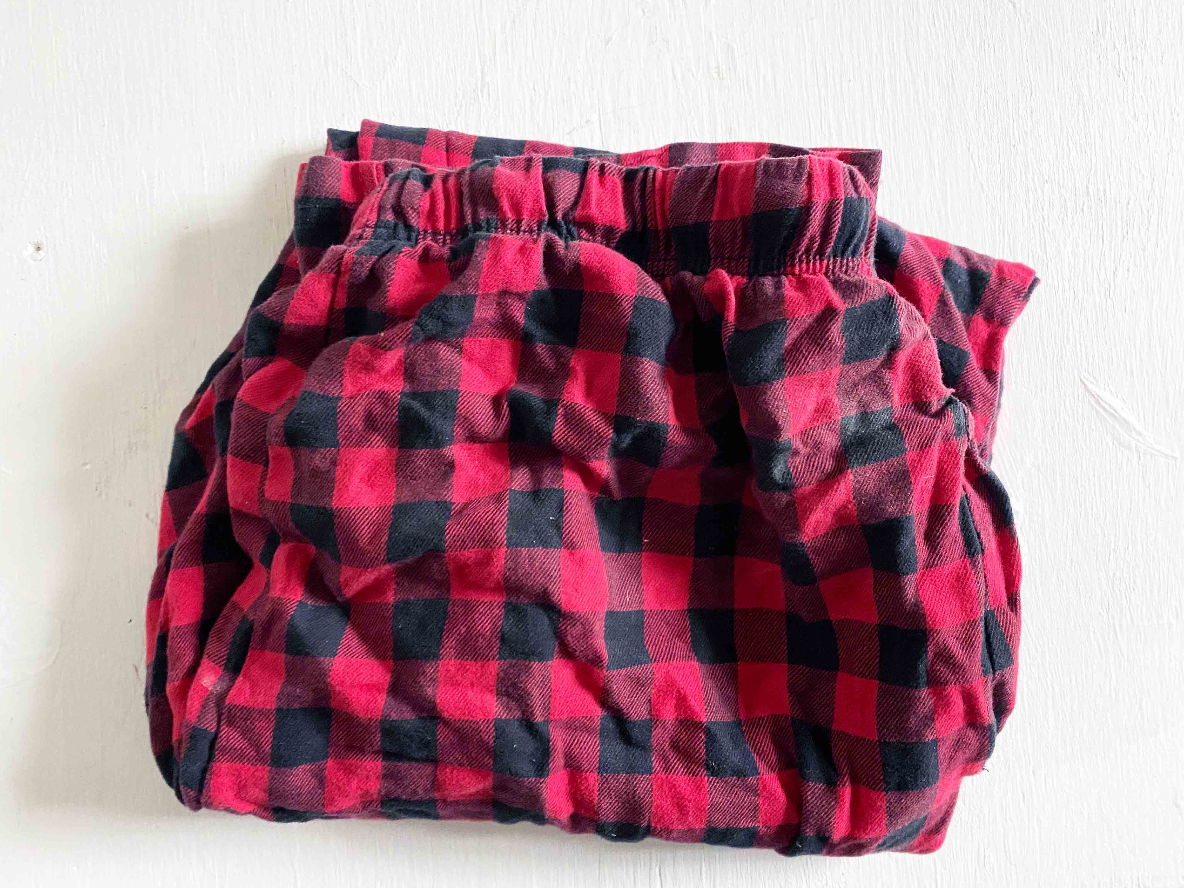 fold pair of red flannel pajama pants